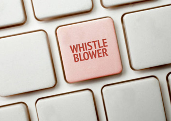 A Black keyboard with a red key and the whistleblower word